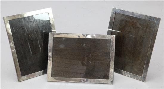 A set of three 1930s large silver mounted rectangular photograph frames by Robert Pringle & Sons, 16in by 11.75in.